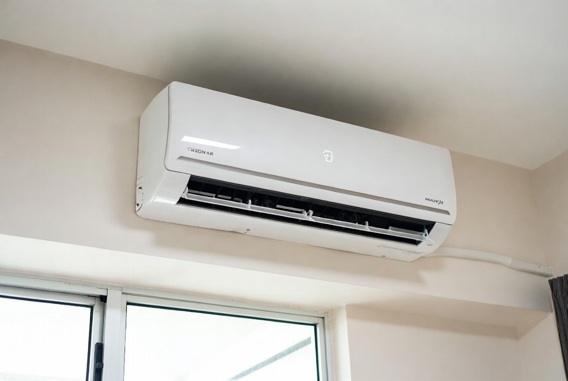 Air conditioner unit mounted on a Singapore HDB wall.