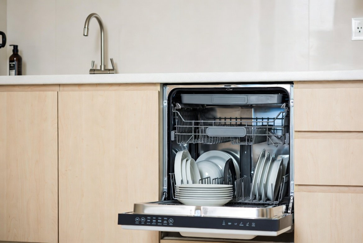 Dishwasher installed under a kitchen counter in a Singapore HDB flat.